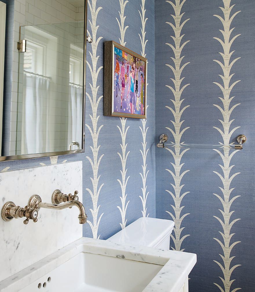 The second floor’s powder room is dressed in Schumacher wallpaper. Photographed by Rebecca McAlpin