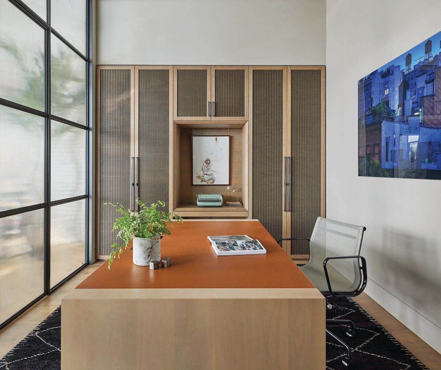 In the office, a custom desk with Edelman leather writing surface by Lagomorph Design   PHOTOGRAPHED BY MIKE SCHWARTZ