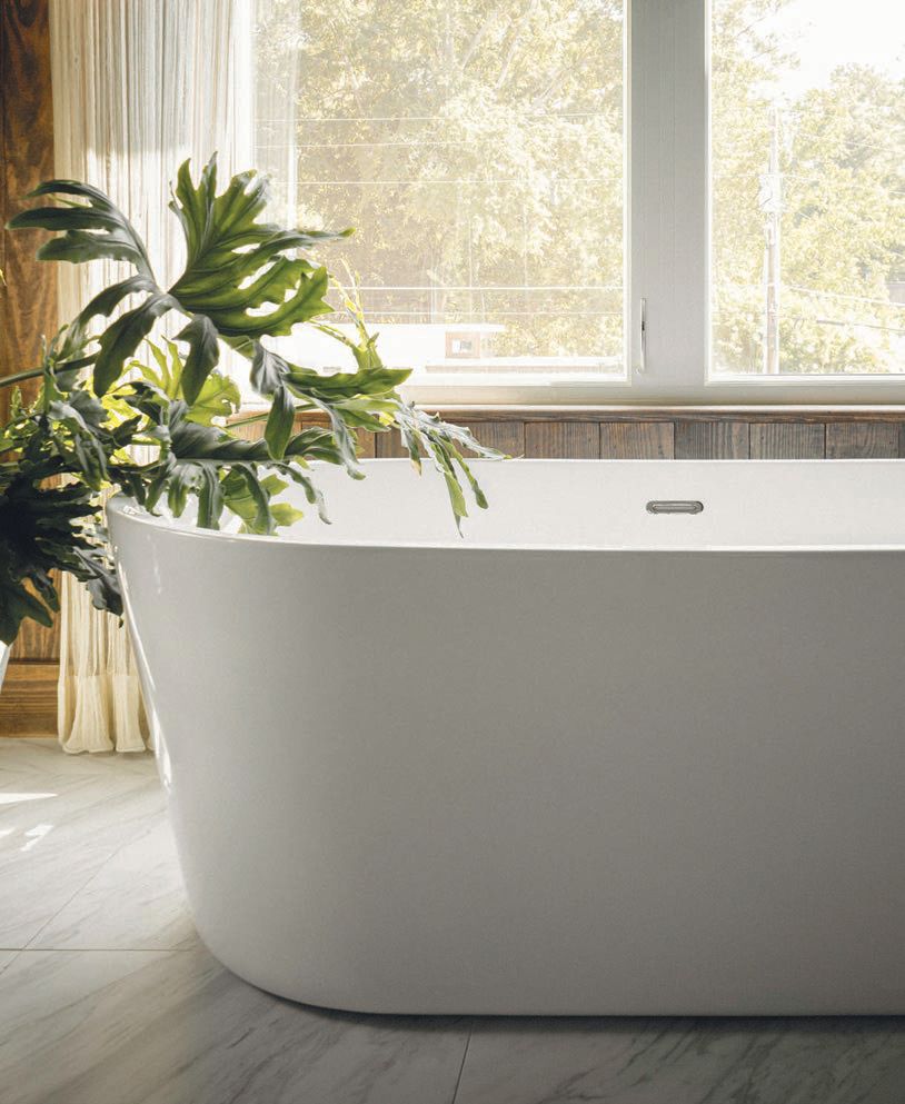 A free-standing tub sourced from Kohler PHOTO BY MORGAN NOWLAND