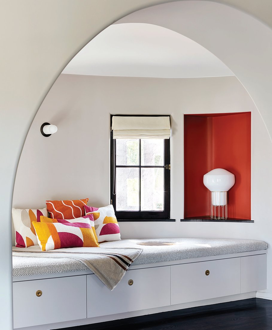 A primary bedroom nook houses a custom daybed upholstered in Larsen fabric—and dotted with Judy Ross pillows—is one of the homeowner’s favorite spots. Photographed by Trevor Tondro