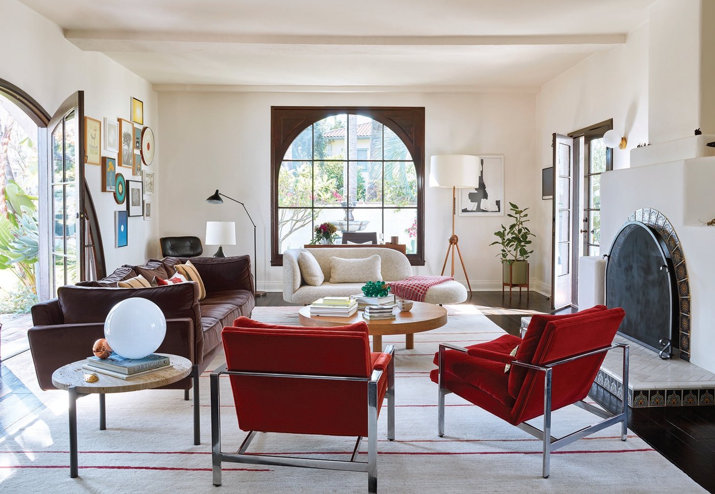 The living room—which contains a De Padova sofa, vintage Milo Baughman armchairs and a settee sourced from The Future Perfect—exudes an air of laid-back sophistication Photographed by Trevor Tondro