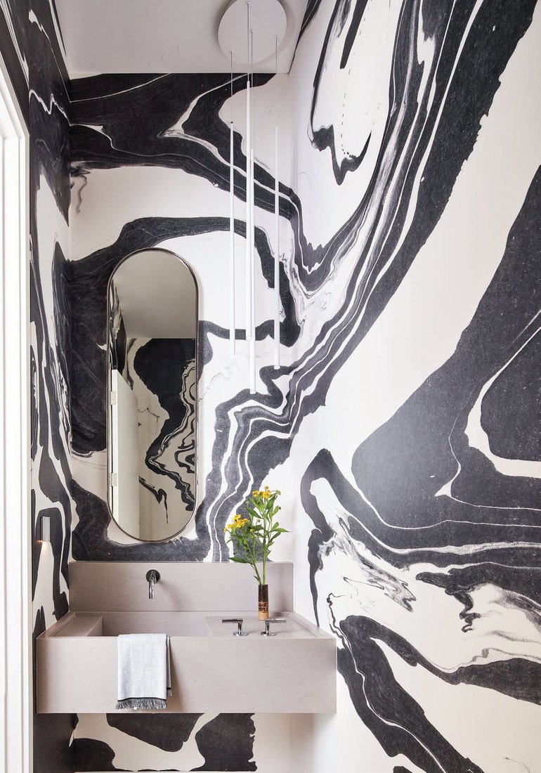 The black and white swirling lines help maximize the feel of the space. IBB DESIGN PHOTO BY DAN PIASSICK