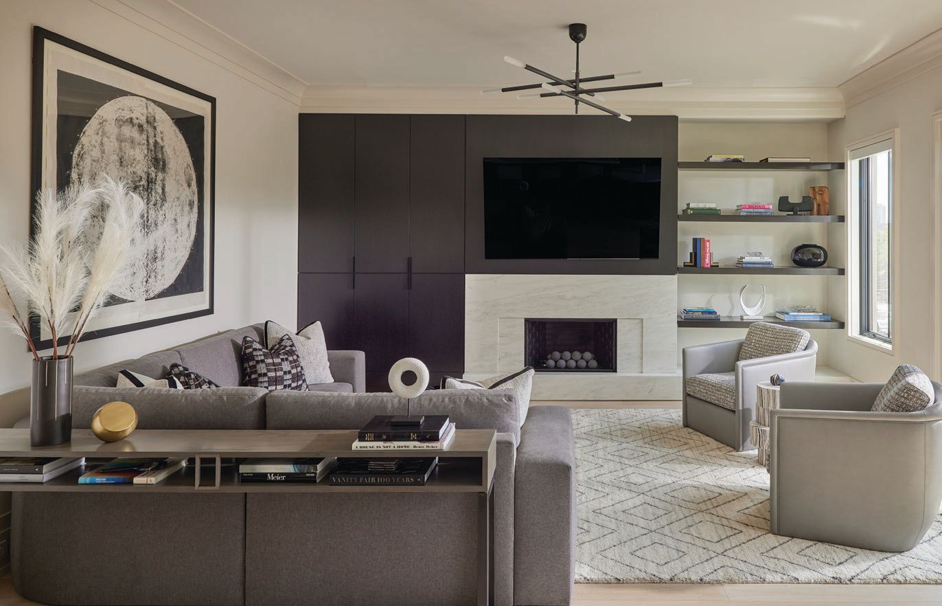 A rug by Oscar Isberian and sofa by Eurocraft Inc. soften the family room. Photographed by Mike Schwartz
