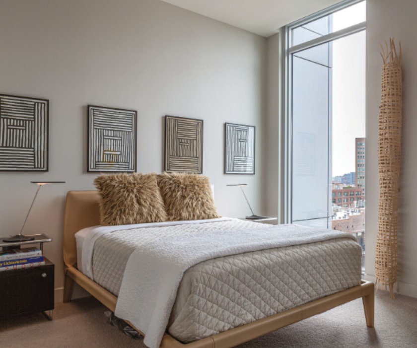 The room’s Vella bed by Design Within Reach is accentuated by a series of untitled sculptures by Annalee Soskin. Photographed by Jill Buckner