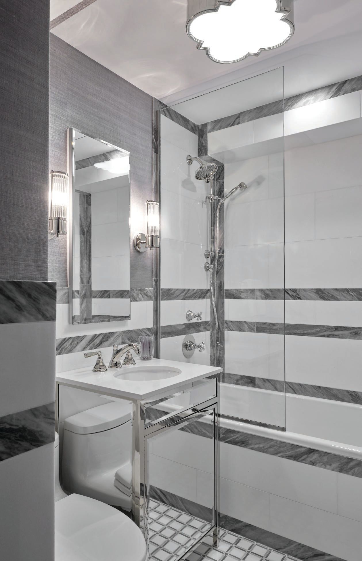 A mirrored sink adds glam to the bathroom. PHOTOGRAPHED BY REID ROLLS