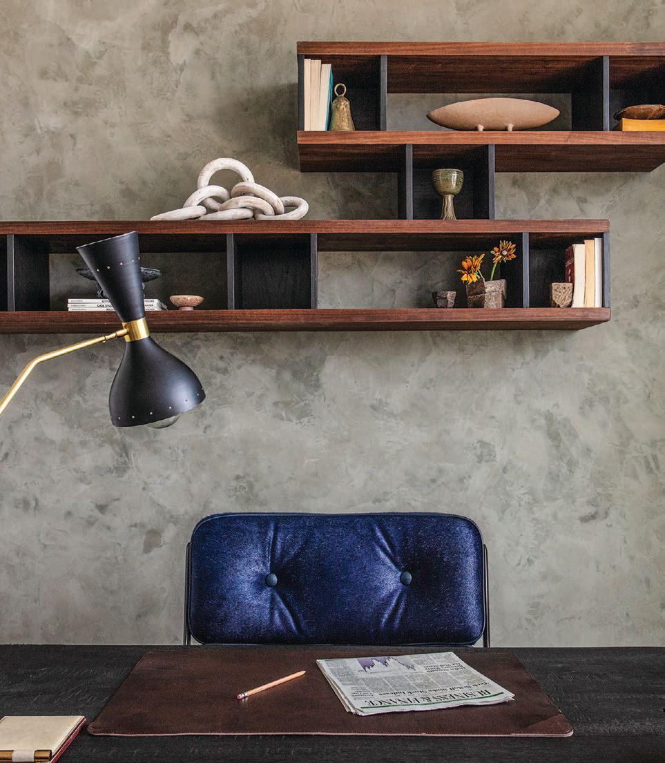The designer scored a major find at Merit in L.A.—an original Eames chair upholstered in blue horsehair—for the home office. The client’s existing dining
table was repurposed for use as a desk. PHOTOGRAPHED BY MICHAEL CLIFFORD