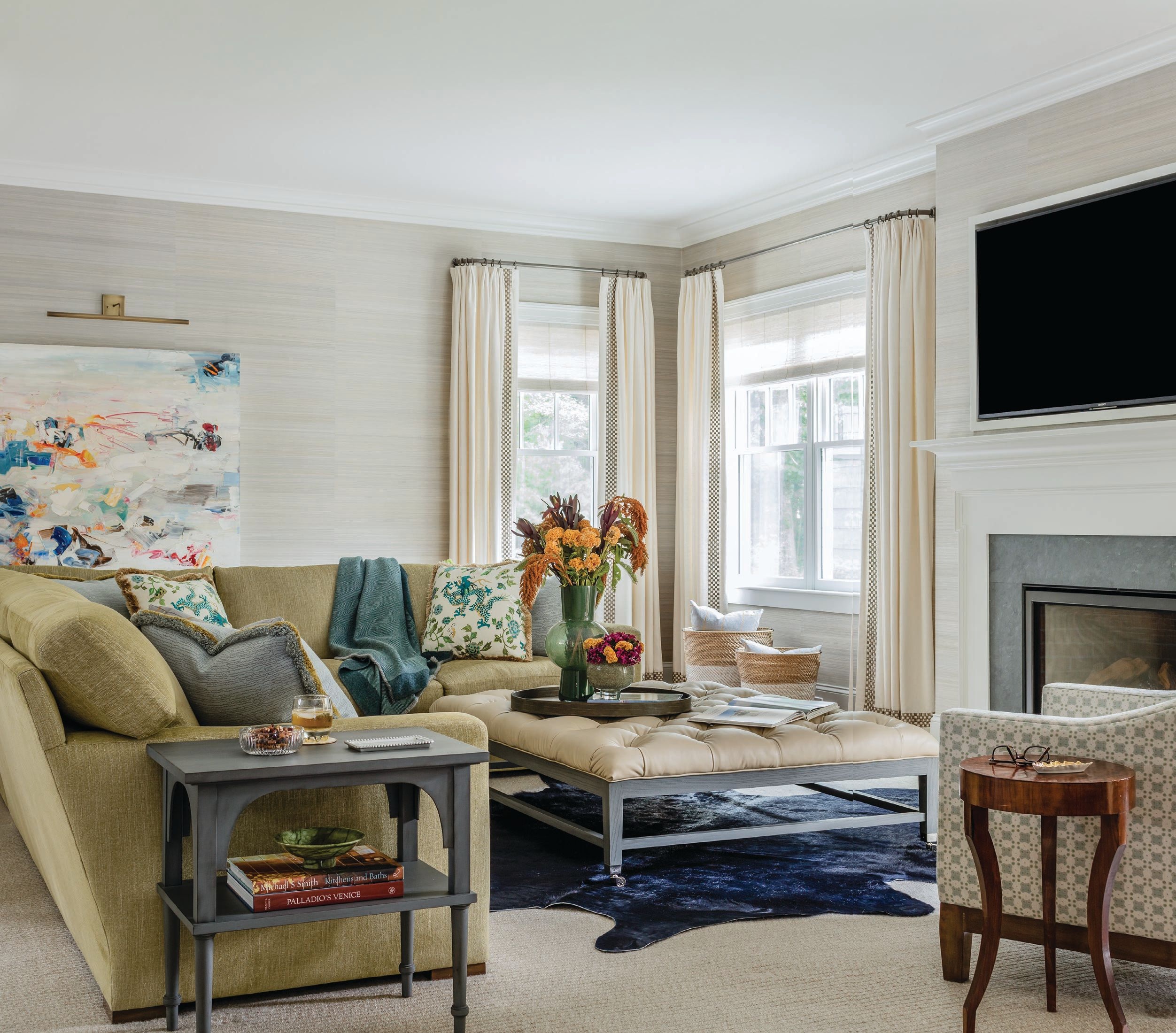 LeBlanc chose a neutral palette in the family room, including a large Verellen ottoman that can face the day-to-day foot traffic in the space. Photographed by Michael J. Lee