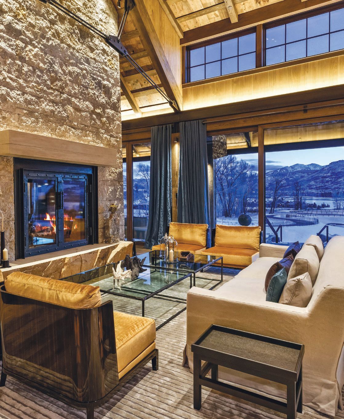 Each home offers spacious living areas with fireplaces and high ceilings featuring windows that maximize views PHOTO COURTESY OF THE RESIDENCES OF ASPEN VALLEY RANCH