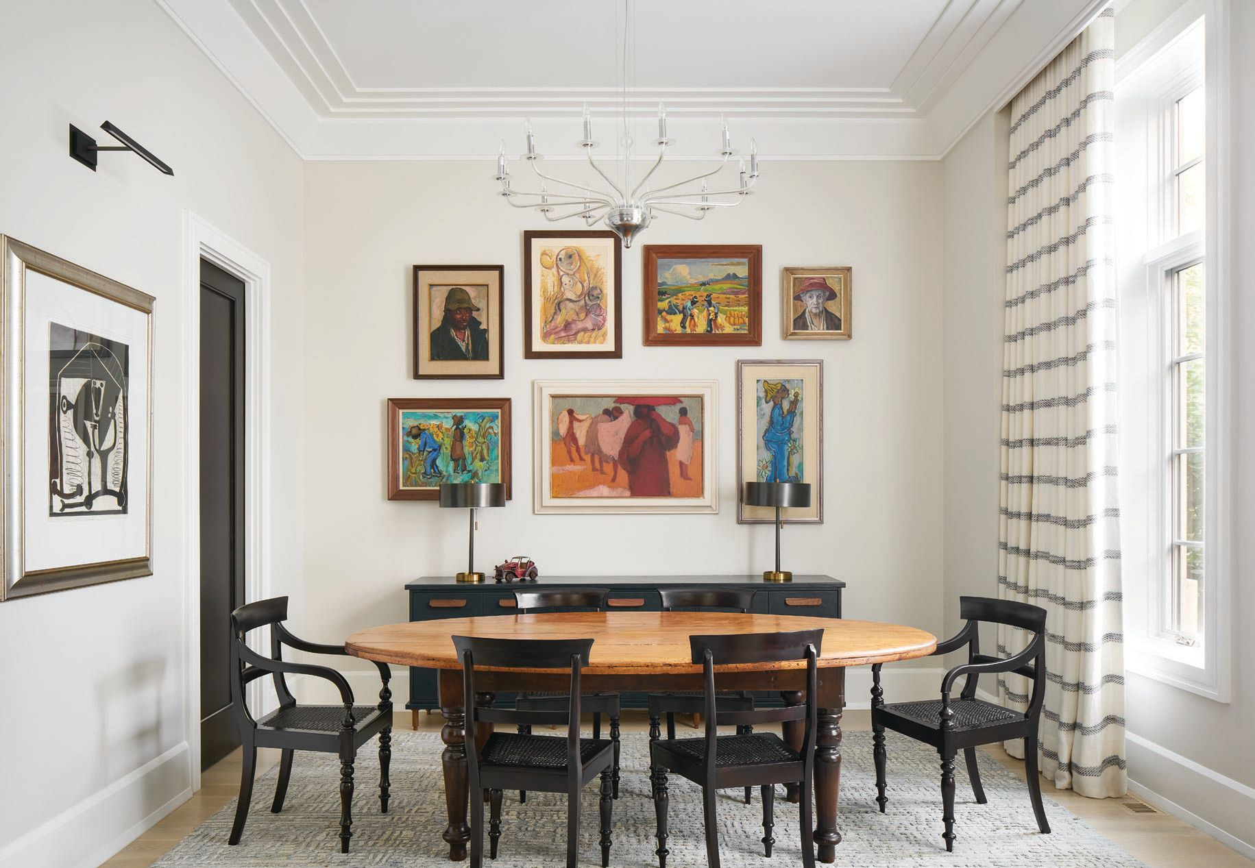 Notes Abrams of his design philosophy, “I believe next to the people in the room, the artwork is the most important element. Knowing this client has a large collection of paintings, we wanted to create a gallery wall in the dining room. The ceiling height, the natural north light and the neutral design palette provided the best backdrop for showcasing their unique collection of paintings.” PHOTO BY RYAN MCDONALD
