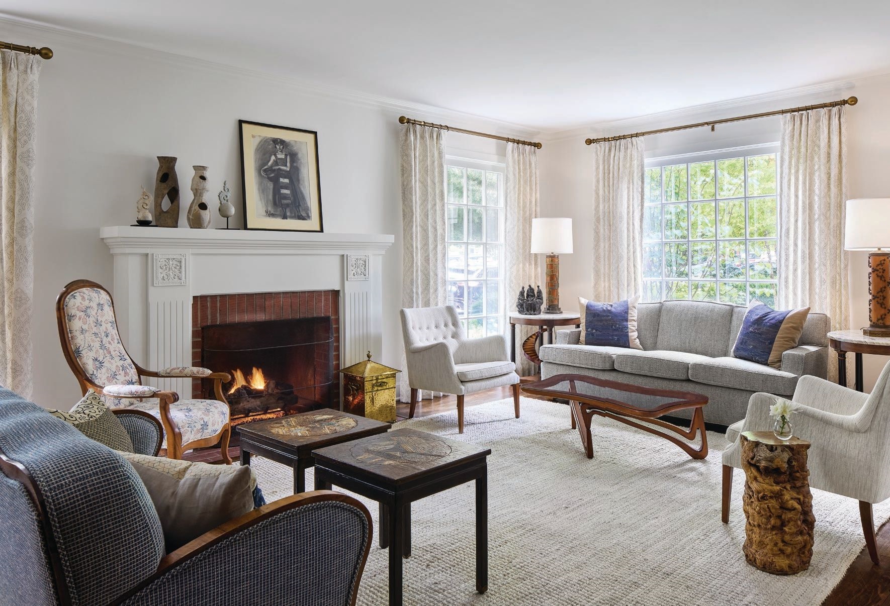 The living room features decorative pillows by textile artist Lynda O’Connor PHOTO BY DUSTIN HALLECK