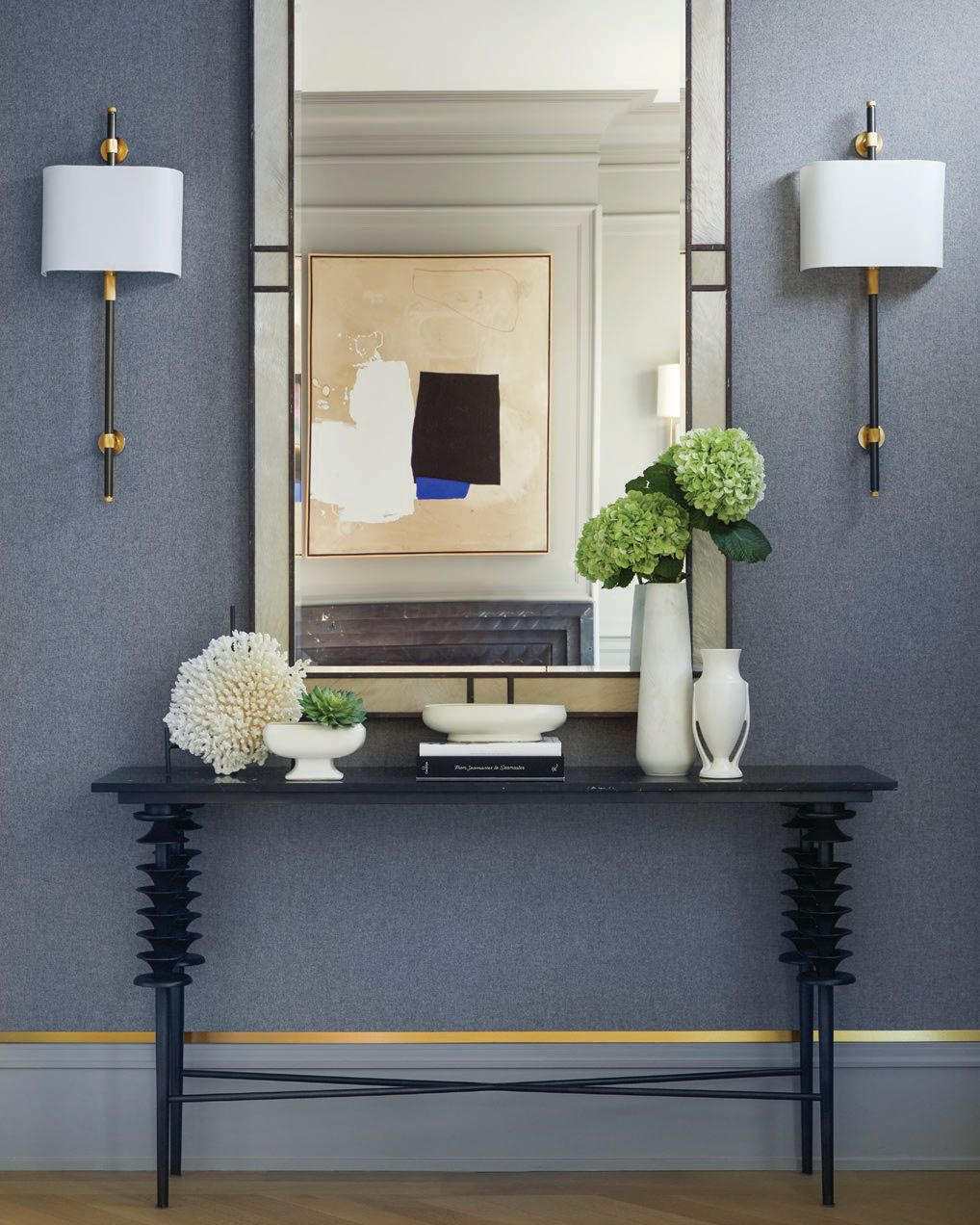 Chester wool nickel wallpaper by Schumacher and a tiered leg console by Alfonso Marina highlight the entry Photographed by Werner Straube