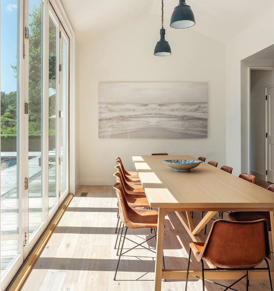 Handstitched leather Capiata chairs from Spain pair with a custom oak MARKZEFF dining table. PHOTOGRAPHED BY EVAN JOSEPH AND TIM WALTMAN