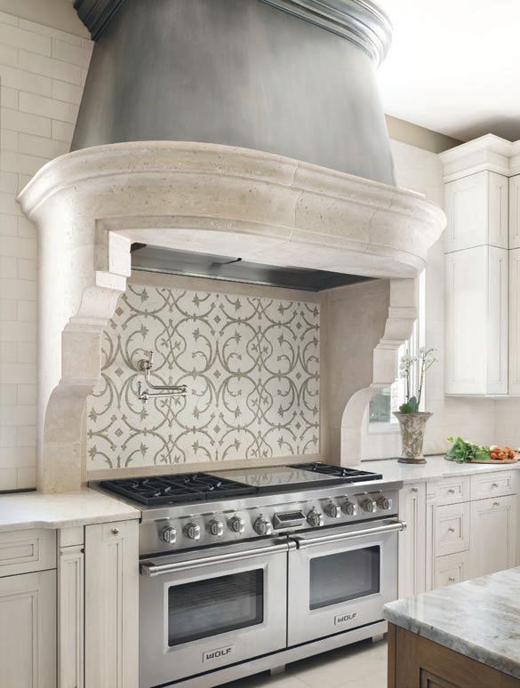 The gorgeous cold-pressed pewter hood from François & Co. offers visual drama to the room. PHOTO BY ROBERT RADIFERA; STYLING BY CHARLOTTE SAFAVI