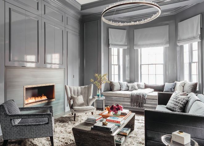 Elms makes this gray-hued living room shine with pops of colors and textures. PHOTO BY MICHAEL J. LEE