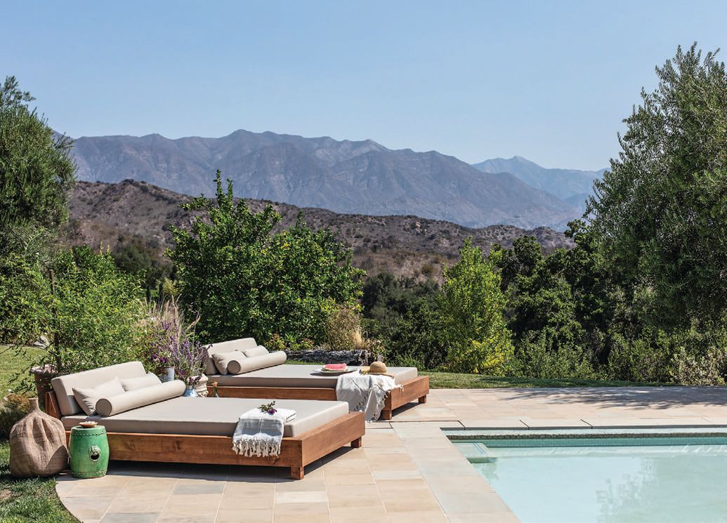 The Ojai outdoor daybed is made of chestnut wood PHOTO BY MICHAEL CLIFFORD FOR HOUSE OF LÉON