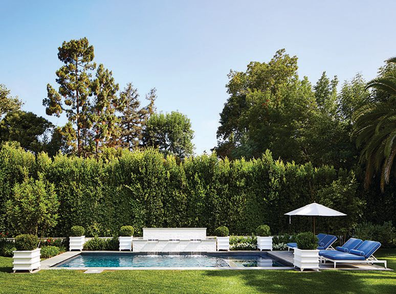 McKinnon and Harris furniture surrounds the pool. Photographed by Trevor Tondro