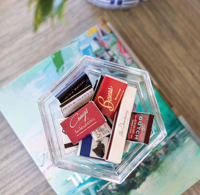 The Garcias’ collection of matchbooks from famous Atlanta restaurants and beyond are on display in the living room. Photographed by Heidi Harris Photography