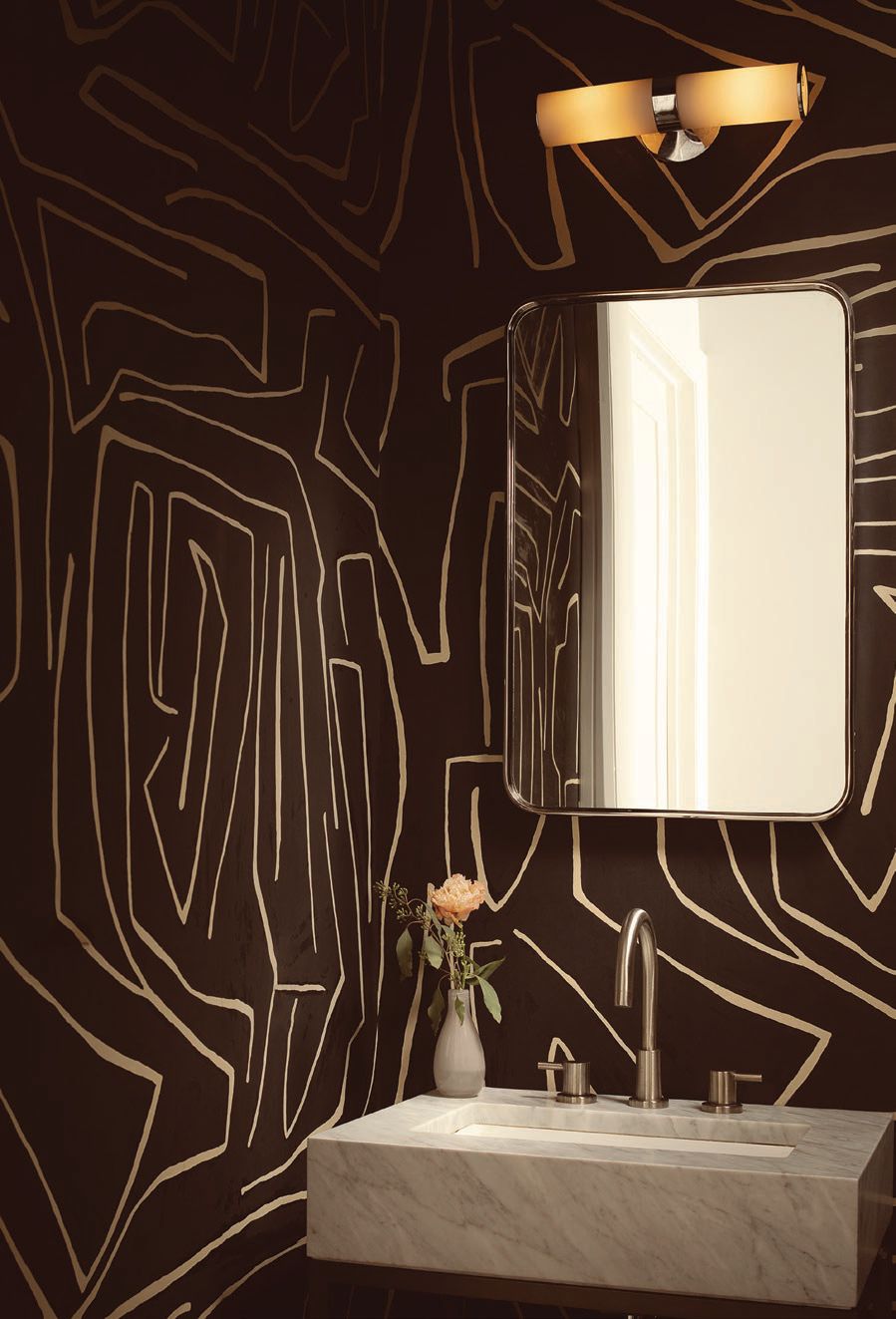 A powder room features an eccentric wall covering. PHOTO COURTESY OF ATRA