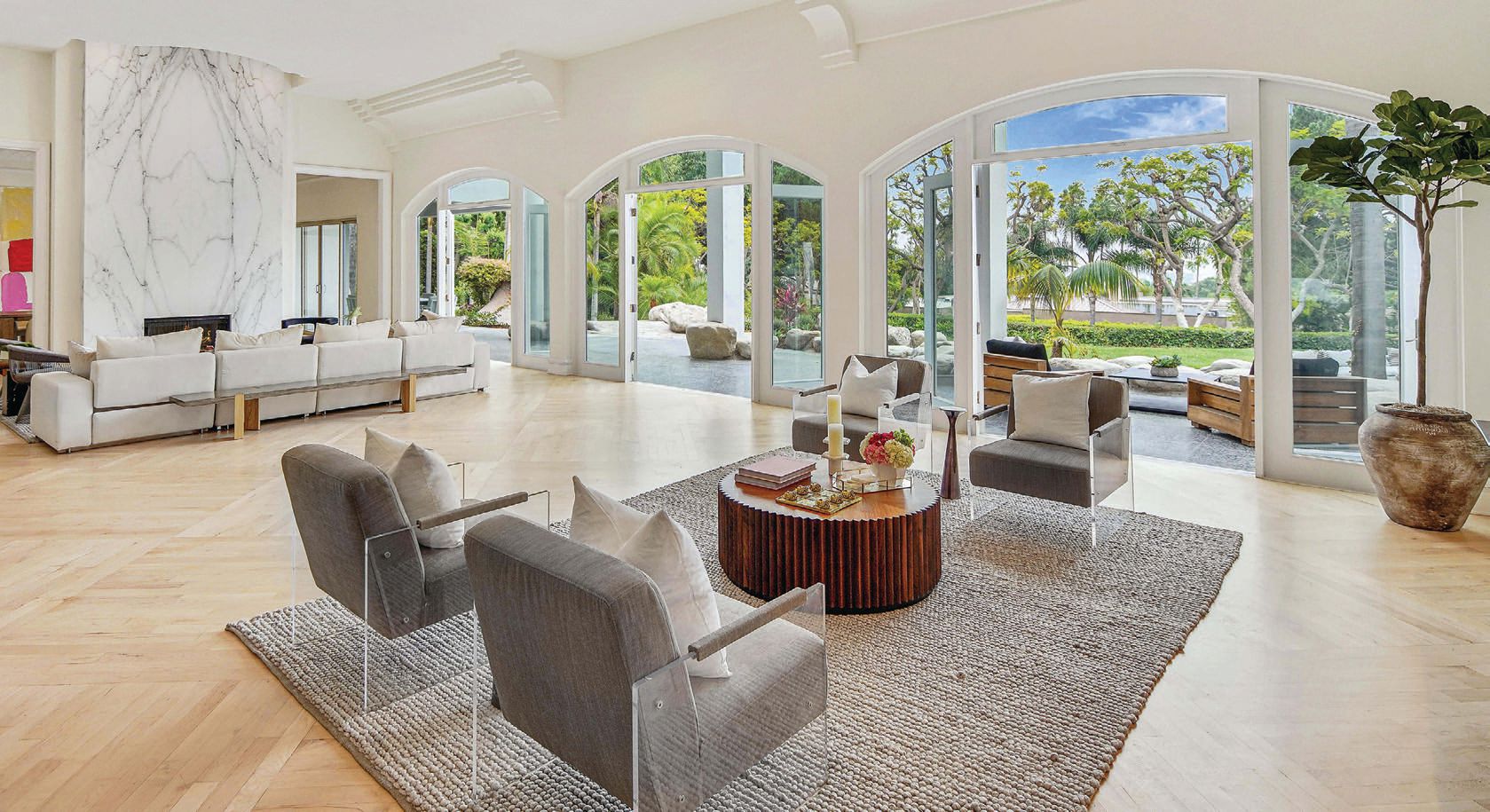 French doors in the living room open to the lush outdoor space. PHOTO BY NOEL KLEINMAN REAL ESTATE PHOTOGRAPHY