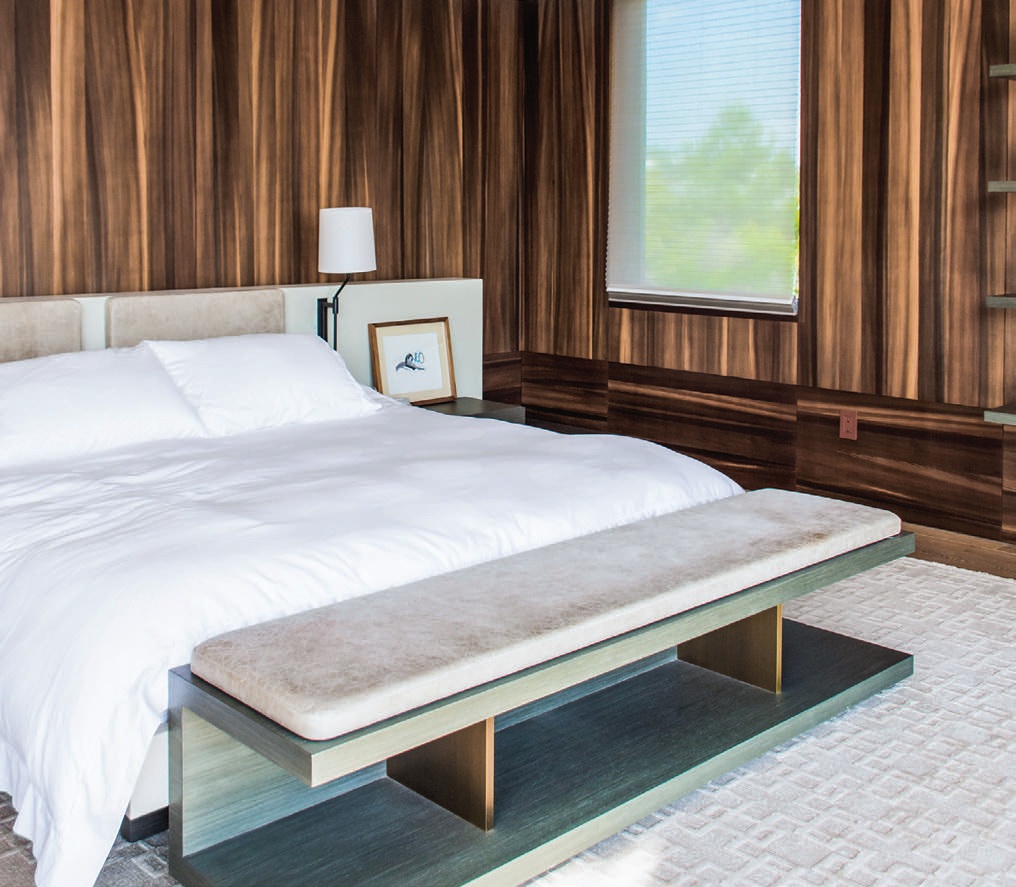 Panels of smoked larch wood veneer cocoon the primary suite, evoking a forest clearing. Streamlined furnishings designed by Hamui underline the room’s serenity PHOTOGRAPHED BY ADRIANA HAMUI