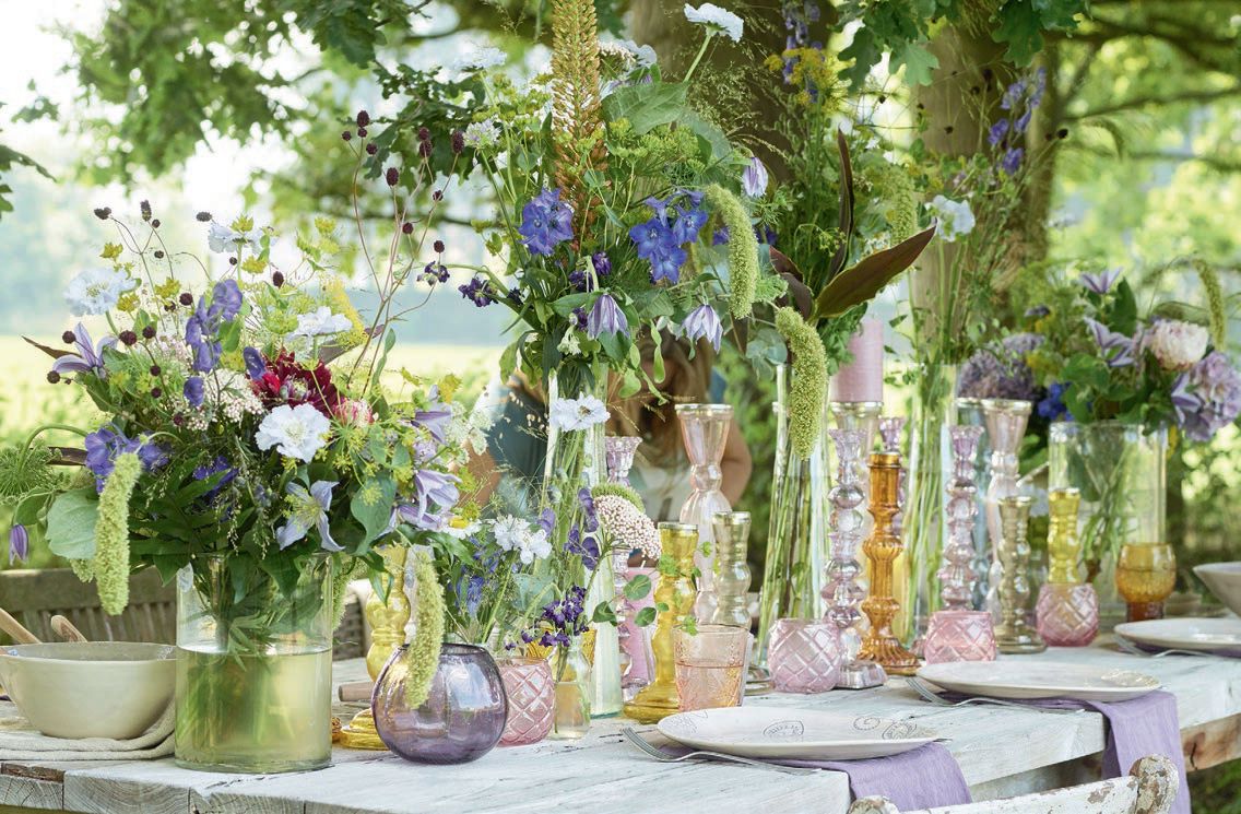 A beautiful tablescape featured in Marie Masureel’s Living With Nature. LIVING WITH NATURE PHOTO BY JAN LIÉGEOIS FOR WONEN LANDELIJKE STIJL