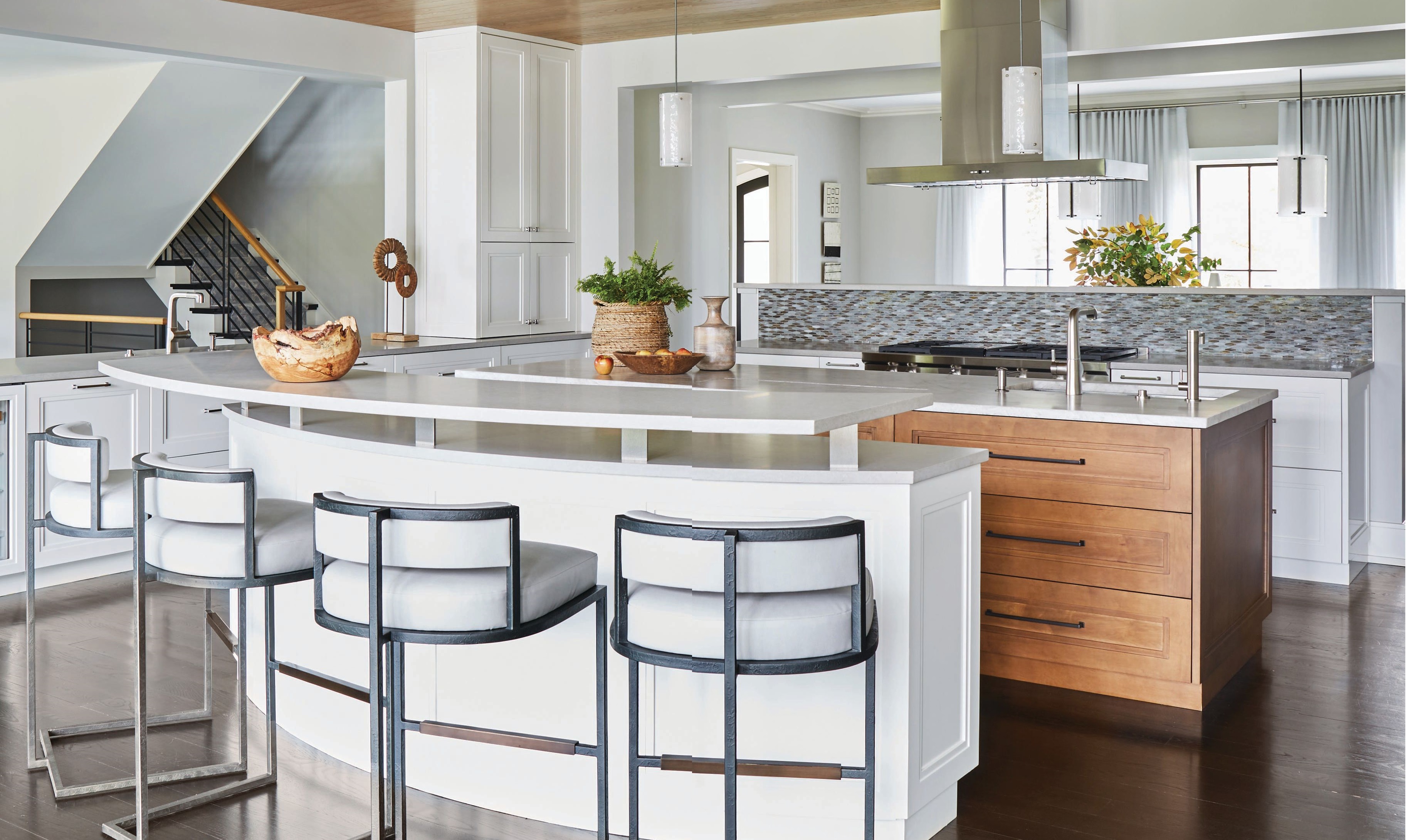 From chic stools by Baker Furniture to Sub-Zero and Wolf appliances and cabinetry by Arbor Mills, the kitchen is a light, airy dream space. Photographed by MICHAEL ALAN KASKEL