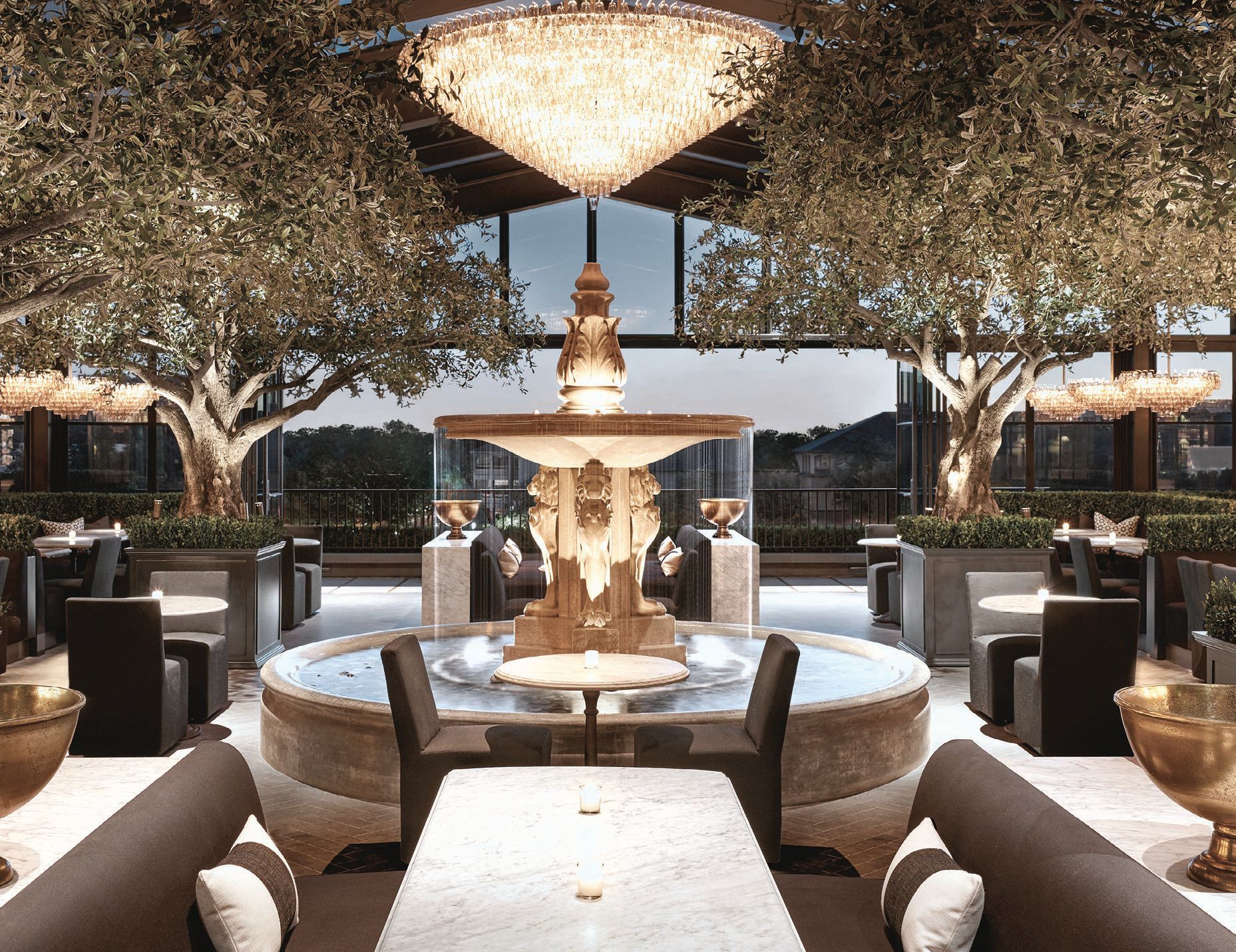 The glass-enclosed rooftop restaurant features retractable walls and is surrounded by exquisite furnishings available for purchase. PHOTO COURTESY OF RH OAK BROOK