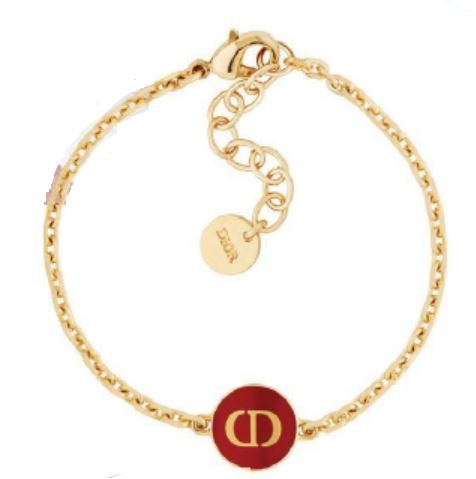 Petit CD bracelet in gold-finish metal and raspberry lacquer PHOTO COURTESY OF DIOR