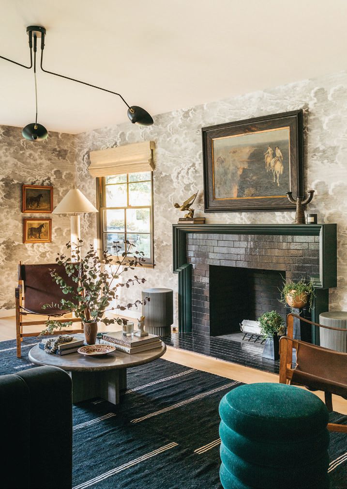 “I love how the fireplace complements the black-and-white Cole & Son wallpaper,” says Blazek, “which provides a neutral backdrop for the art and decor to shine” PHOTOGRAPHED BY ALEX ZAROUR, VIRTUALLY HERE STUDIOS