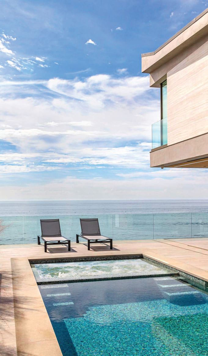 Along with a handtiled pool and jacuzzi, this Malibu beachfront home boasts a rooftop deck with a hot tub PHOTO BY MARCELO LAGOS AND SIMON BERLYN