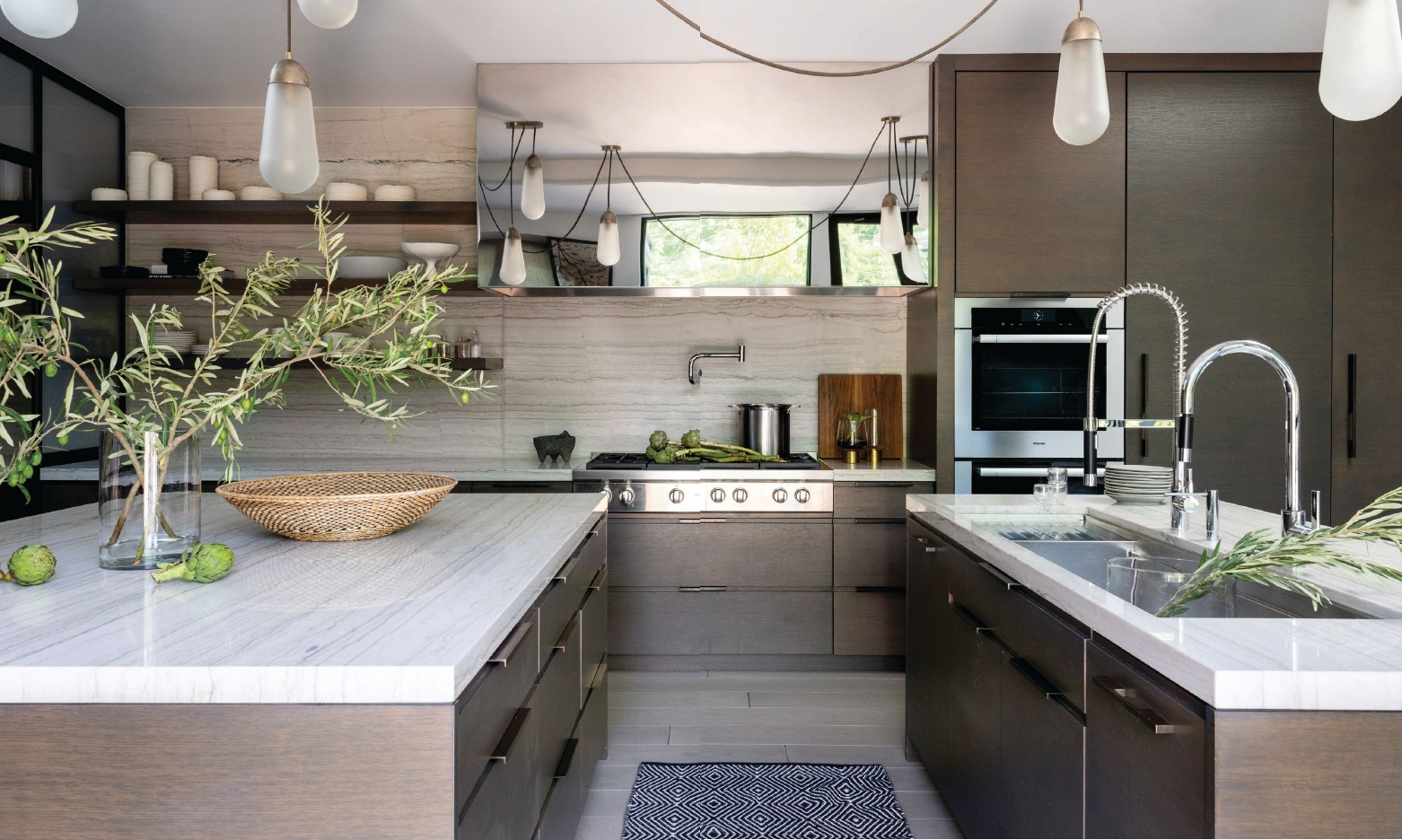 Lariat pendants by Apparatus add a chic touch in the kitchen. Photographed by Aimée Mazzenga