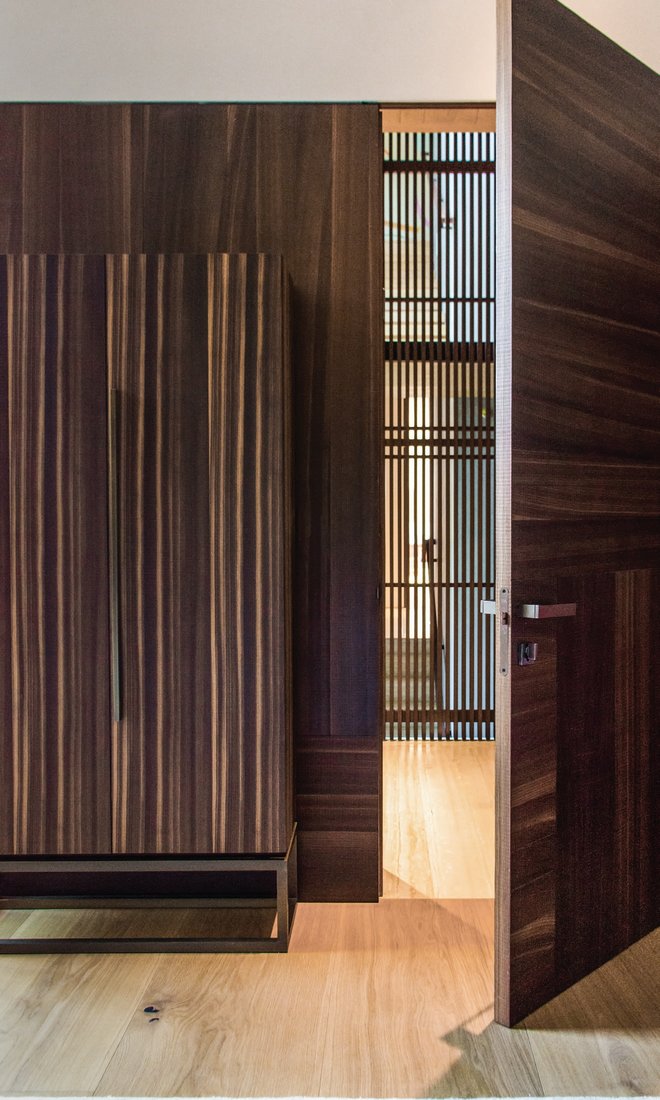 A variety of woods with distinct grains, like the walnut paneling shown here, bring the feeling of the outdoors inside. PHOTOGRAPHED BY ADRIANA HAMUI