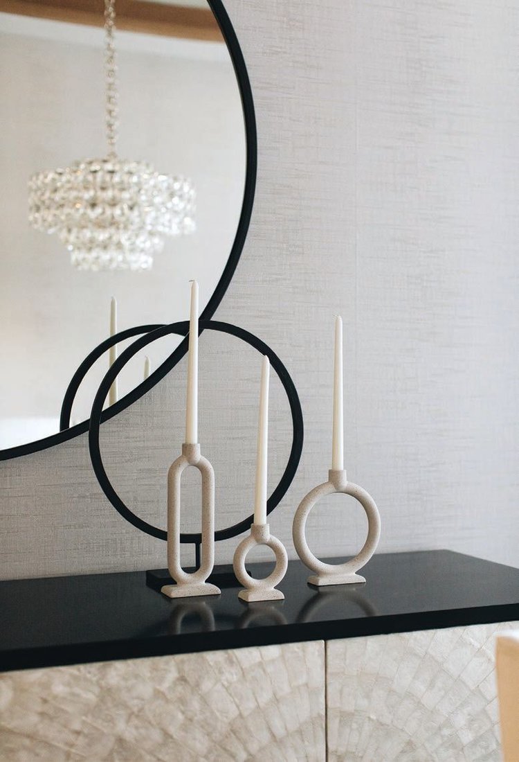 Chic candlesticks perch atop an Adagio buffet by Bernhardt. PHOTOGRAPHED BY STOFFER PHOTOGRAPHY INTERIORS
