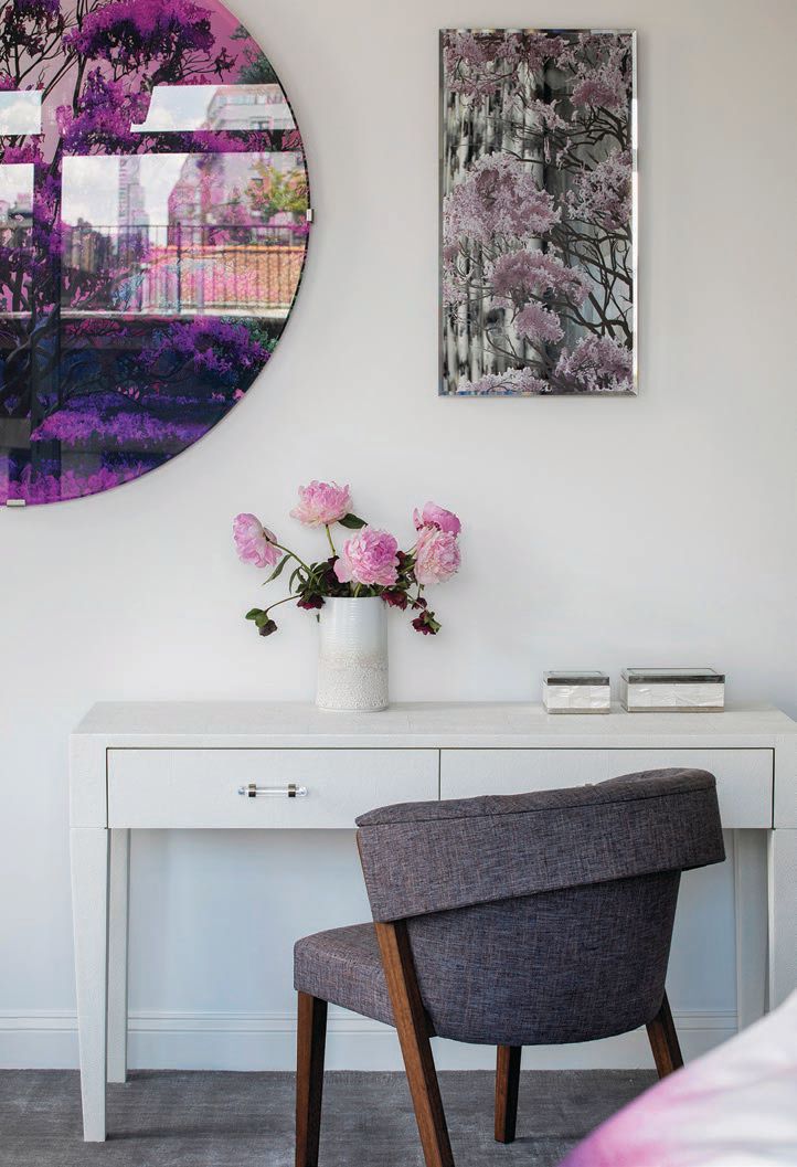 Violet hues pair with a white palette to bring vibrancy into the primary bedroom. Photographed by Costas Picadas