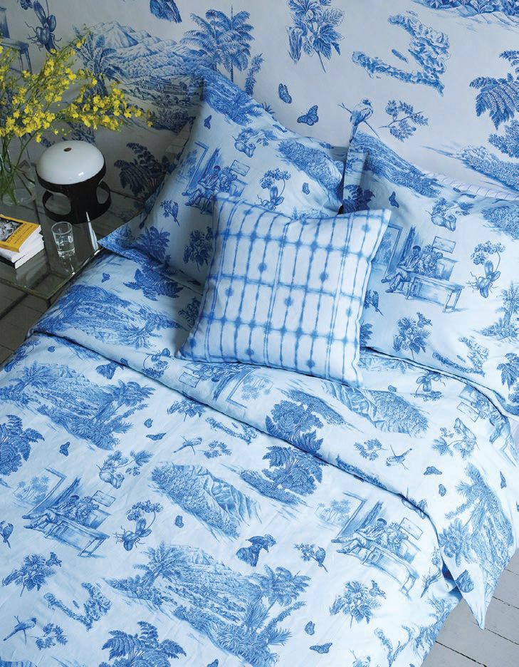 Toussaint Toile bedding and wallpaper accented with a pillow in the fabric Julie—a captivating blue pattern that favors the look of shibori PHOTO BY JASON THOMAS GEERING