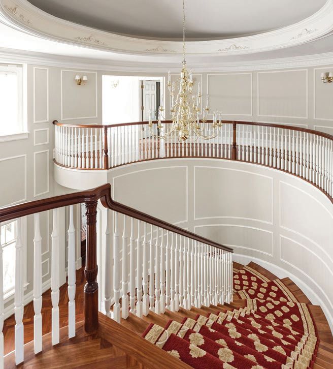 The home's elegant winding staircase PHOTO BY THE HOME AESTHETIC