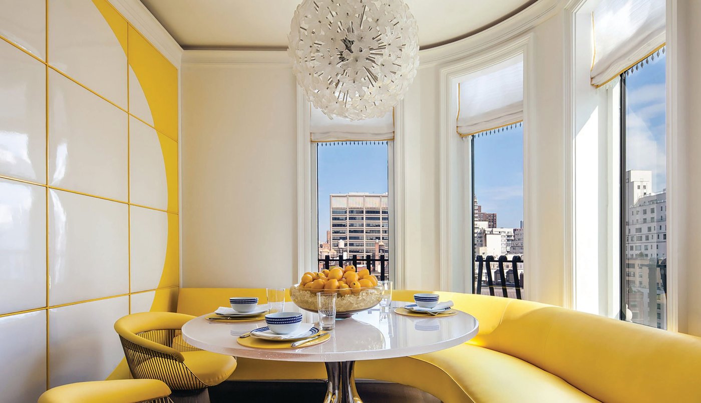 Gold and silver mingle throughout the breakfast room, which features a Philippe Hiquily dining table and Knoll Bertoia chairs. PHOTO COURTESY OF ARTHUR DUNNAM INTERIOR DESIGN