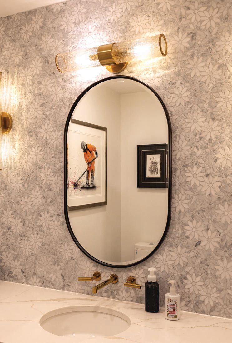In the powder room, Rockart daisy flower marble mosaic tile by Roca Tile creates a meaningful design moment Photographed by Kyle Flubacker