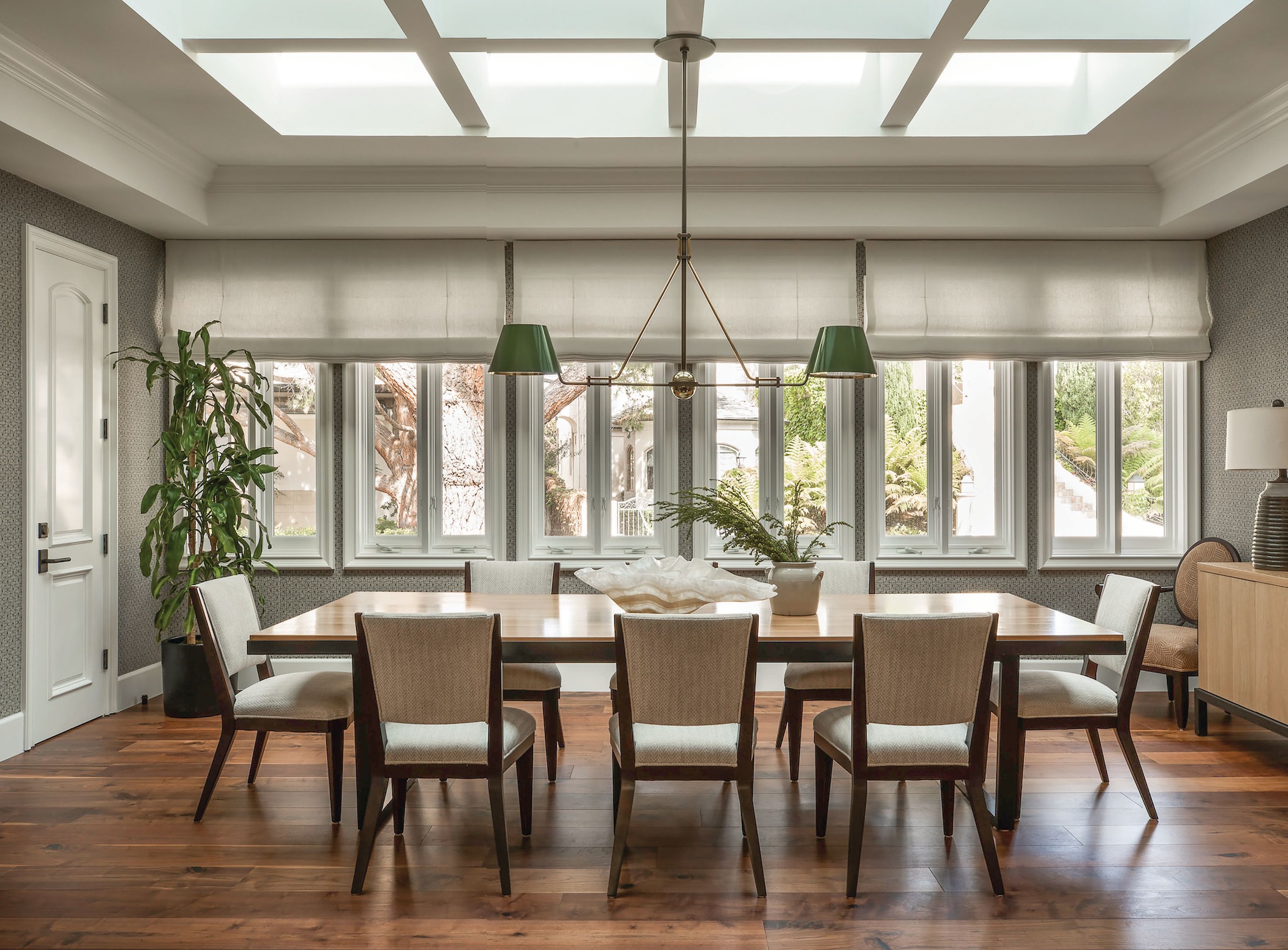 The elegant dining room contains a House of Morrison Montecito table, chairs by Hickory Chair and the Chiltern Double chandelier from Urban Electric. PHOTOGRAPHED BY SHADE DEGGES