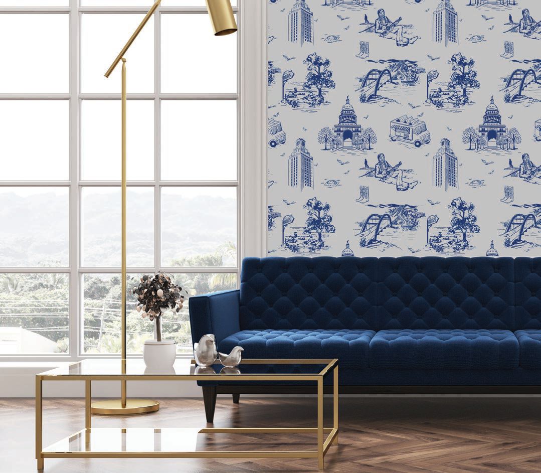 The navy Austin toile wallpaper gives this room a polished look