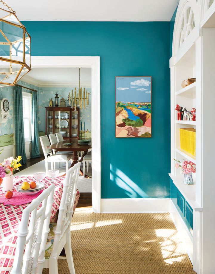 Walls covered in Vardo paint by Farrow & Ball make the breakfast room pop.