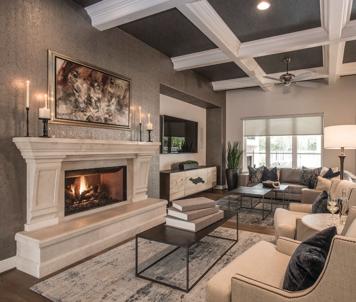 In the family room, textured wallcoverings teamed with coffered ceilings enhance the ambiance the space. Photographed by Scott Sandler